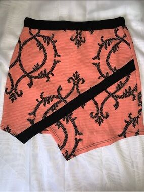Asymmetrical Coral Mini Skirt with Black Trim